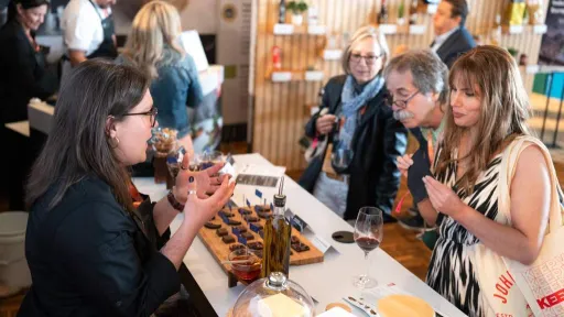 Visitors interacting at an EU food exhibition in the US