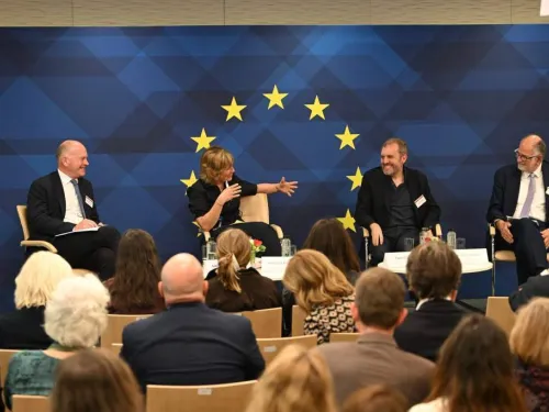 Event stage at Taste of Europe event, panelists sitting in front of the EU emblem